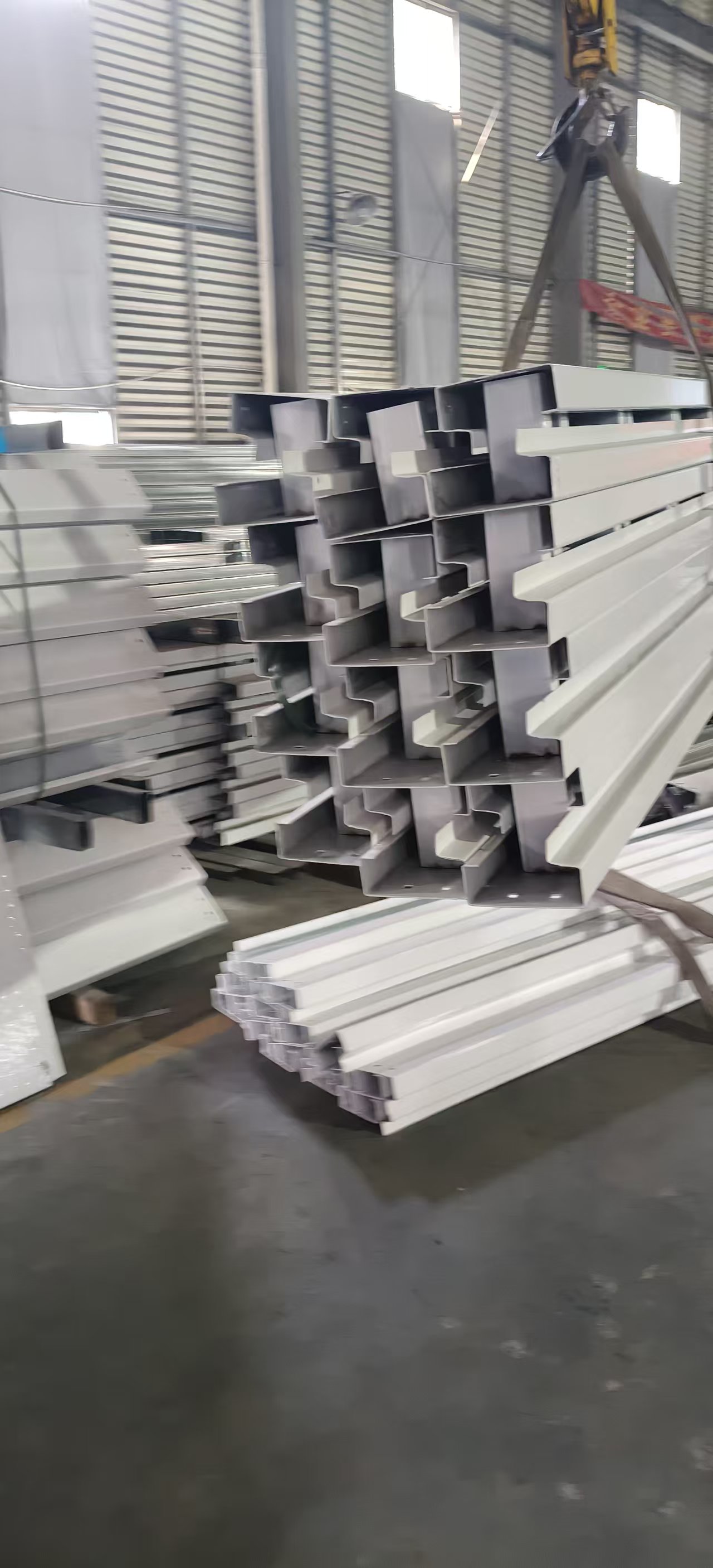 Workers handling modular framing components